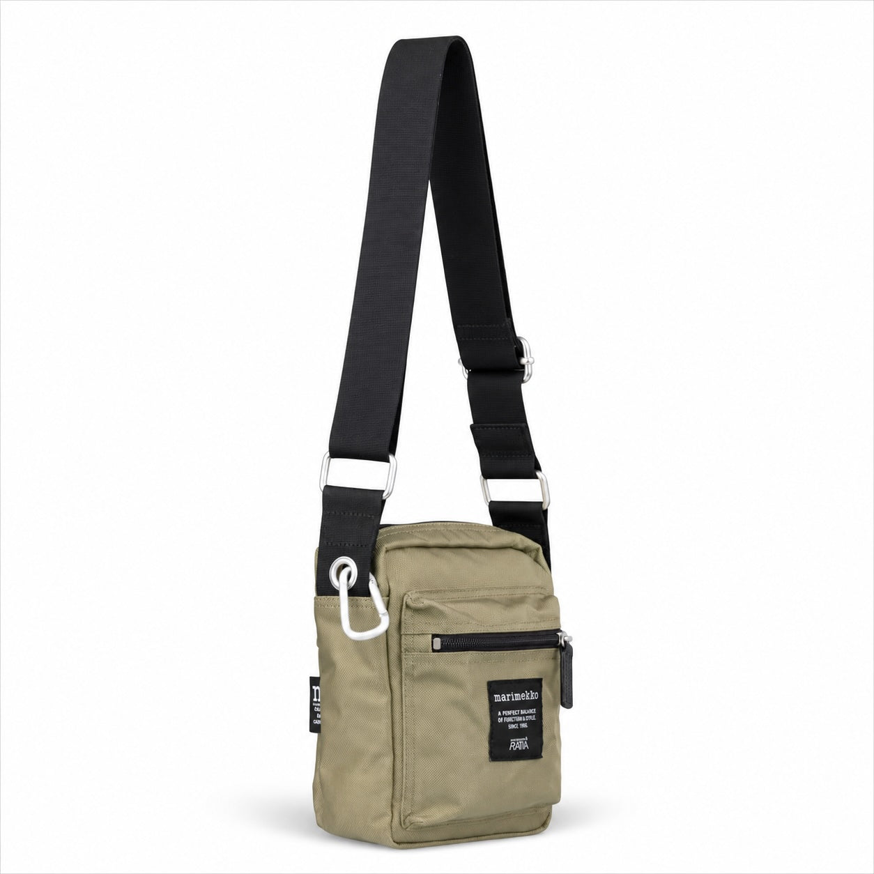 A small crossbody bag in olive green with a wide black adjustable strap, silver metal hardware, and a black brand patch on the front pocket, shown against a plain white background.
