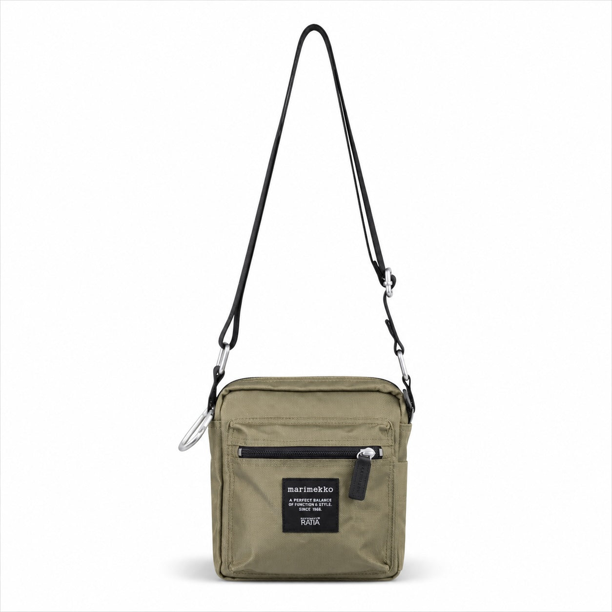 An olive green crossbody bag with a black adjustable shoulder strap, a front zippered pocket, and a black brand patch that reads 'martinelli'.
